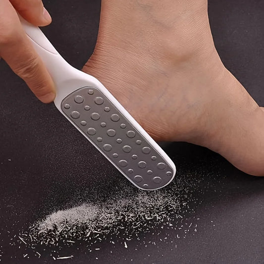 Stainless steel foot file being used on foot for callus removal